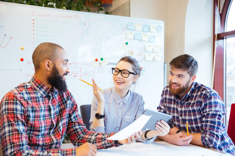 Multiethnic group of happy business people working together in office Multiethnic group of happy business people working together in office